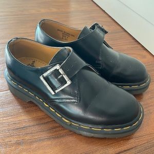 Vintage England Made Dr. Martens black buckled loafer shoes.